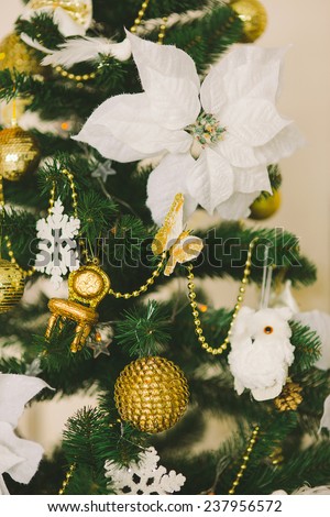 New Year\'s and Christmas interior in gold color with a fir-tree