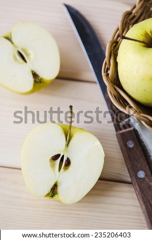 yellow wet fresh apples in a wicker basket