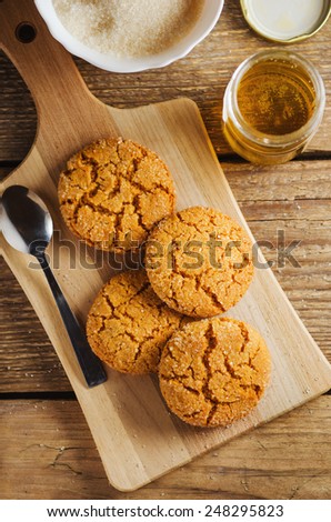 homemade sugar cookies with  honey on a wooden board