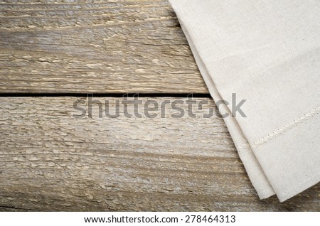 natural beige cotton cloth on a wooden table