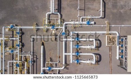 Aerial top view natural gas pipeline, gas industry, gas transport system, stop valves and appliances for gas pumping station.