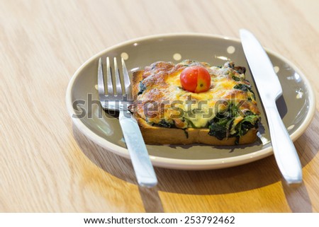 Spinach Toast, sandwich baked with spinach, cream cheese and egg. tinting. selective focus