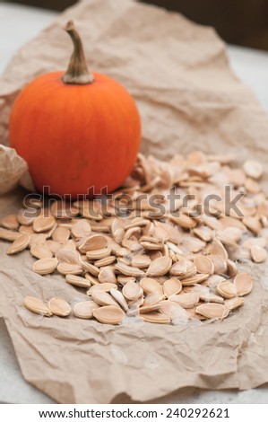 Pumpkin seeds on brown wrapping paper.