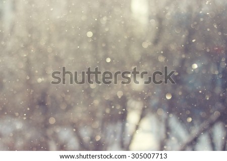 Blurred abstract background. Sunlight winter snowflake background. Magic light background.