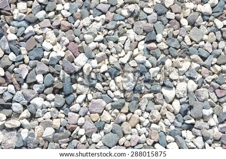 Several stones of different shapes along a path.