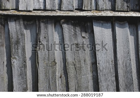 Old fence from dingy planks. Abstract background.