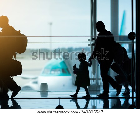 Silhouette of family at airport