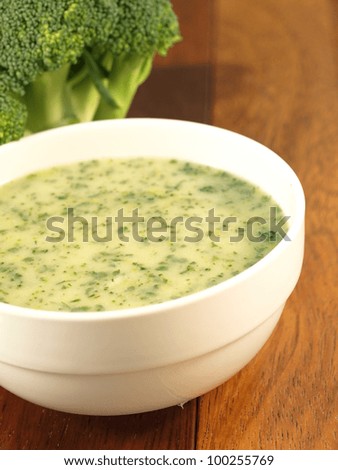 Tasty homemade broccoli soup in white bowl