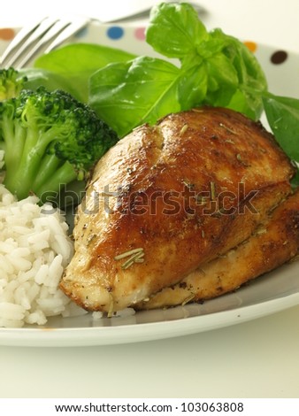 Close up of tasty dinner with golden chicken
