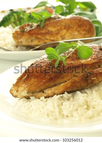 Fried chicken and rice for dinner on white plates