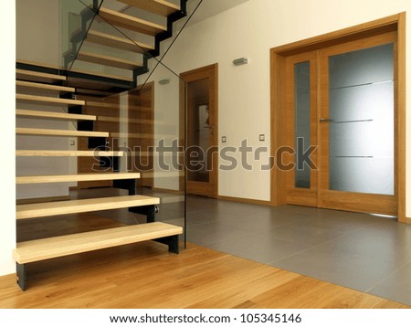 Wooden and glass stairs in the modern house interior