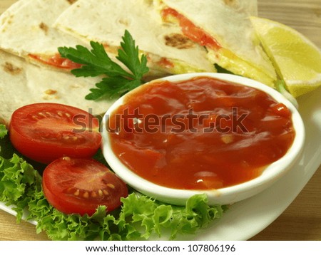 Quesadillas snack made from tortilla with cheese and sauce
