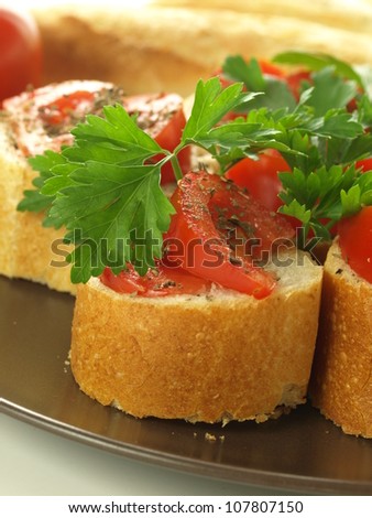 Traditional italian snack with tomatoes and herbs