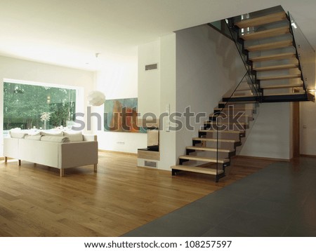 Contemporary house: staircase and a living room