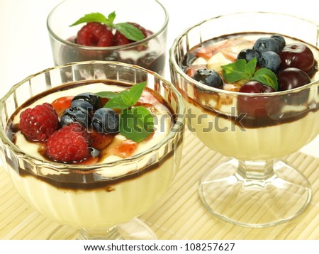 Two vanilla puddings and raspberry summer dessert
