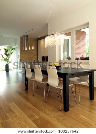 Dining room with dark table and bright chairs