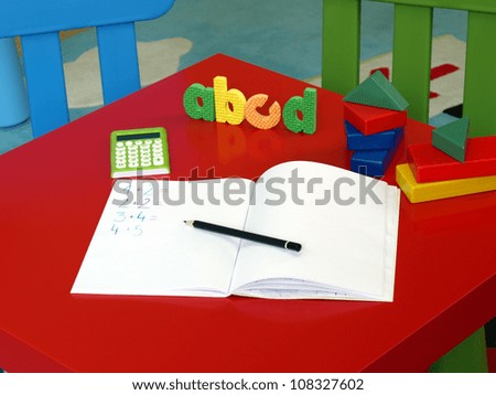 Place with exercise book for child to work