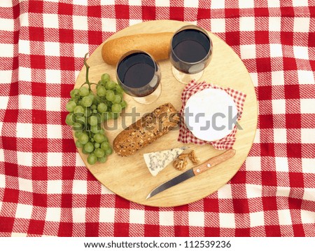 Bird eye view of o cheese board with wine