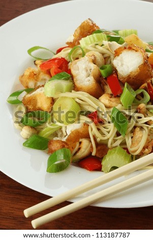 Portion of chinese salad with fish and noodles