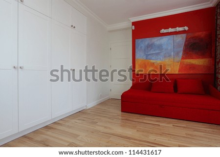 Modern white and red room with painting