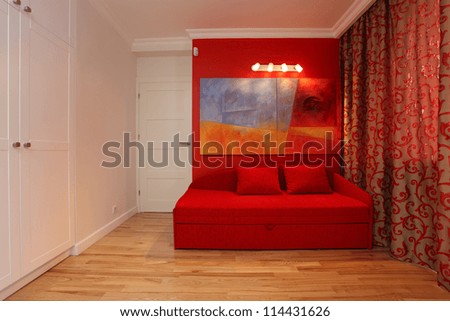 Romantic room with red couch and curtains