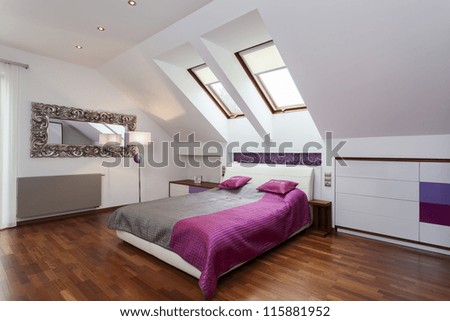 Modern Bedroom In The Attic Of Contemporary House