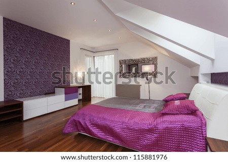 White and purple bedroom with patterned wall
