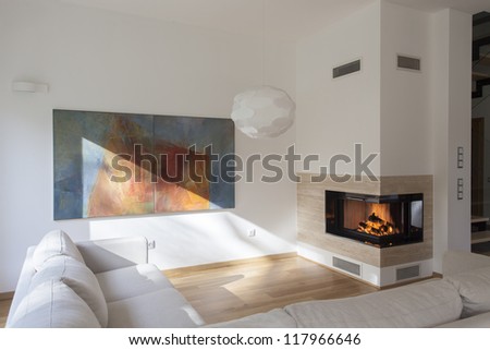Cosy living room with original painting on wall