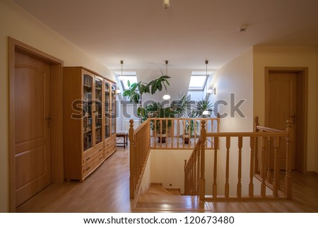 Wooden stairs, doors and shelves on the attic
