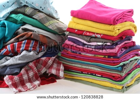 Heap of clothes with ironed shirts, isolated background