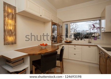 Cloudy home - bright interior of practical kitchen
