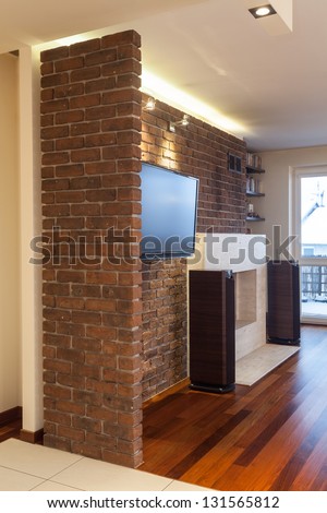 Spacious apartment - Stone wall inside of living room