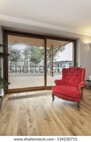 Tuscany - red vintage armchair in living room