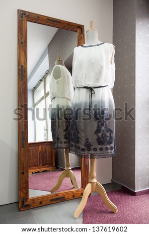 Pattern of a dress on wooden mannequin