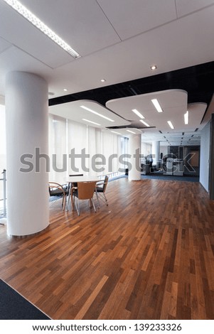 Luxurious office with designers lighting and exotic wooden floor
