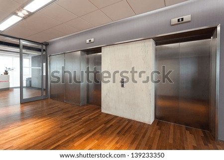 Office interior, hall with two elevators