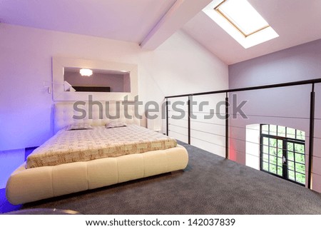 Purple bedroom on entresol of the loft