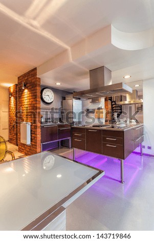 Interior of a new modern kitchen with neon lights