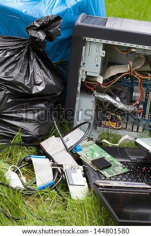 Closeup of a broken electronics on a grass