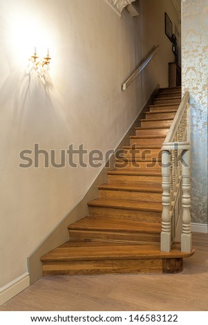 Vintage mansion - wooden stairs with a white barrier