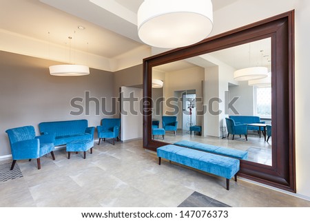 Huge mirror with frame nad colorful furniture