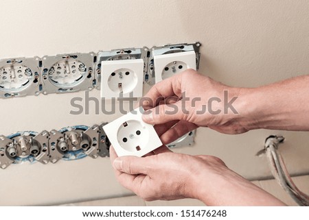 Repairing electricity in house- changing power socket