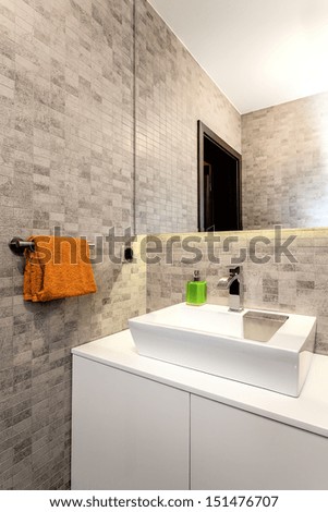Urban apartment - White basin and counter in bathroom