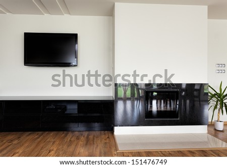 Urban apartment - modern fireplace with stone wall around