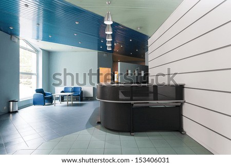 Blue And Grey Reception In A Hallway Of Factory