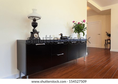 Bright space - an elegant black cabinet with drawers
