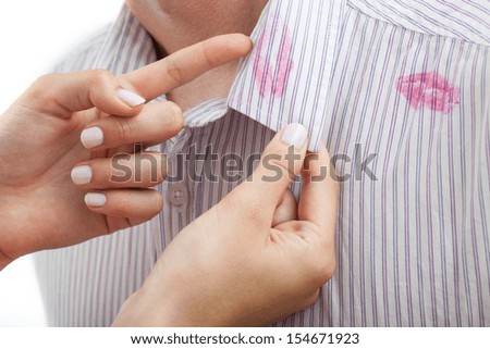 Man with kisses on a collar and his angry wife