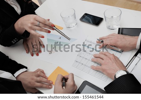 Business people analyzing the agenda and chart