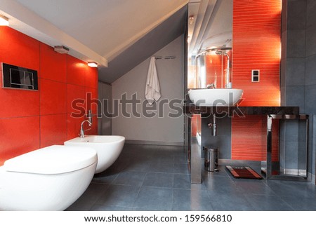 Red And Grey Bathroom With Wc And Bidet