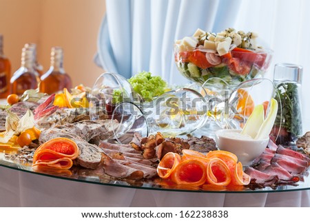Sliced meat on a luxury decorated banquet table